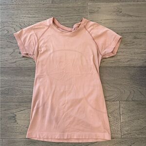 Pink swiftly tech  Short Sleeve shirt 2.0 hip length